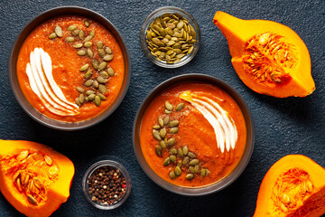 Pumpkin soup with seeds and spices close-up