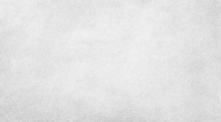 A close-up of a subtly textured, light gray surface with a slightly mottled appearance, suggesting a paper or fabric-like material