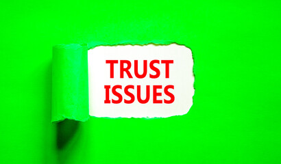 Trust issues symbol. Concept word Trust issues on beautiful white paper. Beautiful green paper background. Business trust issues concept. Copy space.