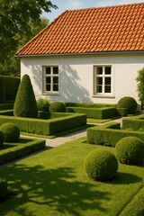 Obraz premium Manicured garden with hedge sculptures and white house in sunny setting