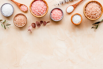 Spa treatment body care cosmetics - sea salt and scrubs in bowls, top view