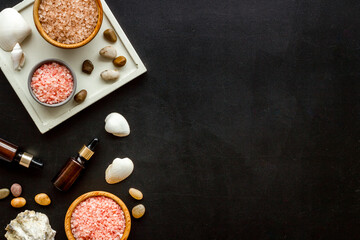 Set of body care cosmetics products with essential oil scrubs and sea salt, top view. Aromatherapy spa products
