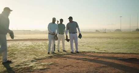Sunrise sparking diverse baseball teammates walking onto mound, pointing gloves planning pitches