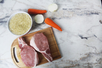 raw meat rice onion carrots with space for text copyspace