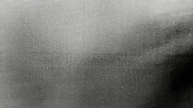 fine metallic mesh closeup with silver grid pattern creating abstract industrial texture for modern background or surface design