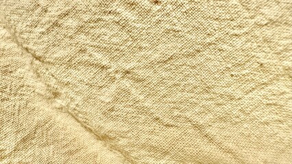 closeup of rough beige burlap textile with natural woven fiber detail ideal for rustic background or vintage texture design