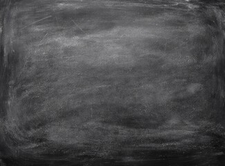 A dark gray textured chalkboard, slightly smudged and showing signs of previous use, with subtle variations in shading and faint streaks