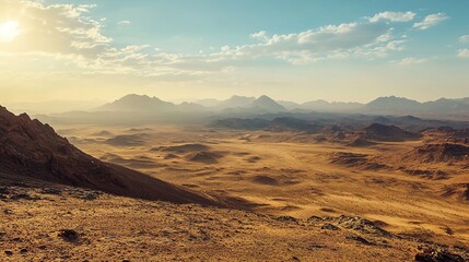 Fototapeta premium A vast desert landscape under a bright sky, with mountains in the distance and a warm sunlight illuminating the sandy terrain.
