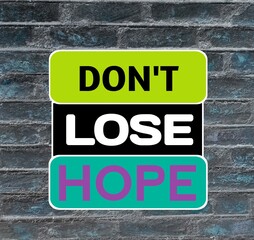 Obraz premium Don't lose hope, motivational and positive quote about life with bricks wall background. 