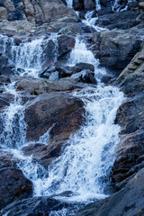 Mountain water flows over rocks