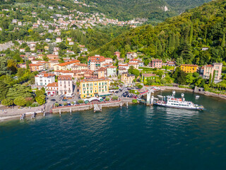 Varenna, Como lake. Picturesque village in Lombardy, Italy. Aerial panoramic drone view of beautiful town with colorful houses surrounded by mountains