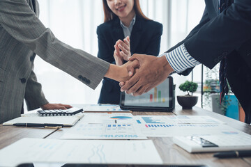 Business handshake for teamwork of business merger and acquisition,successful negotiate,hand shake,two businessman shake hand with partner to celebration partnership and business deal concept