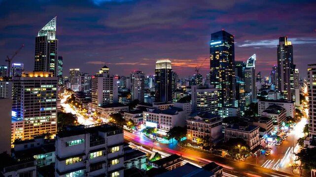 The Urban Skyline of Specific Asian Financial District During Dusk Illuminated Structures and Vehicle Light Trails During Peak Hour Captured with Prolonged Exposure