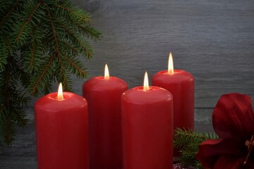 Four Advent candles are burning.