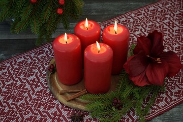Four Advent candles are burning.