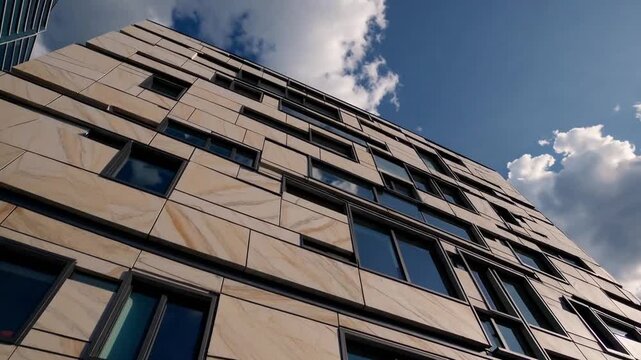 contemporary structure featuring rainscreen cladding system utilizing mineral material located in urban development zone