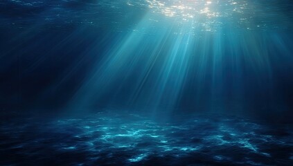 Sunbeams pierce deep ocean darkness, illuminating a textured seabed