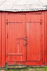Past days sealed in wood — a locked red boat shed in Andenes stands as a quiet monument to work, weather, and waiting on the Norwegian coast.