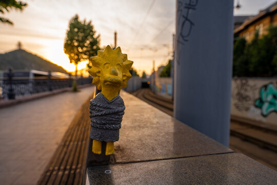 Budapest, Hungary: July 07, 2024: Kolodko, tied Lisa Simpson sculpture. Sunset golden light on the background. Wide angle shot.