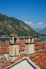 Fototapeta premium Church with red roofs, panoramic view, old town Kotor, Montenegro