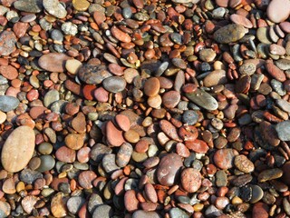 wallpaper of different colored stones on the beach in summer