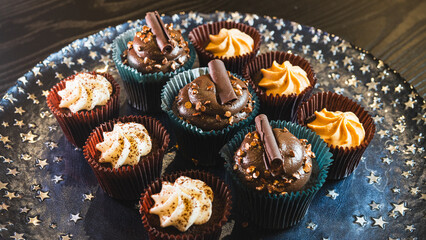 Beautiful assorted chocolate cupcakes with creamy frosting and colorful toppings, styled on a chic plate. Ideal for dessert content, baking inspiration, and joyful food storytelling.