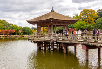 Obraz premium Ukimido pavilion on Sagi pond in autumn, Nara, Japan