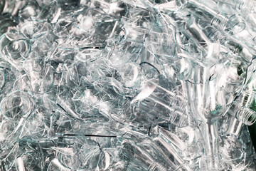 Broken glass bottles — chaotic texture of post-consumer waste, symbolizing recycling and environmental urgency