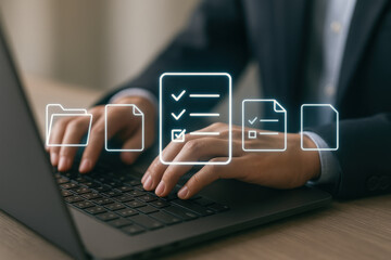Naklejka premium Businessman typing laptop with digital checklist and file icons, showing productivity