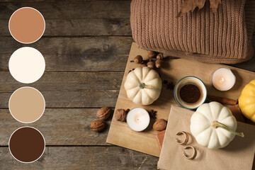 Cup of tasty pumpkin coffee with autumn decorations, books and warm sweater on brown wooden background