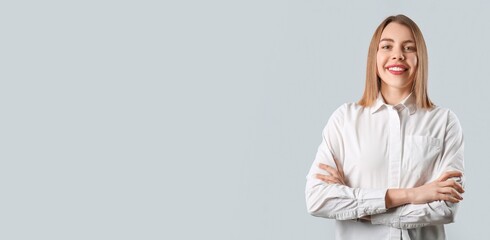 Female business consultant on grey background with space for text