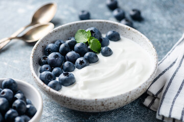 Greek yogurt bowl with blueberries. Healthy diet meal