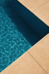Empty swimming pool with clear blue water and sunlit tiles in minimalist design