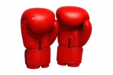 Red boxing gloves hanging against transparent backdrop, symbolizing competitive martial arts