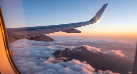 Obraz premium Aircraft View Mountains Emerge Amidst Cloudscape during Sunset Flight journey