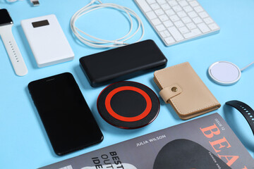 Composition with modern gadgets and magazine on color background
