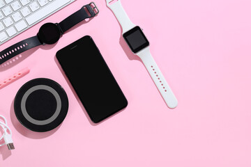 Set of modern gadgets on pink background