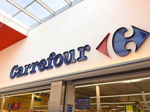 Udine, Italy - August 26, 2025: Carrefour supermarket sign displayed prominently in a retail environment, showcasing brand identity and inviting shoppers to explore the store's offerings