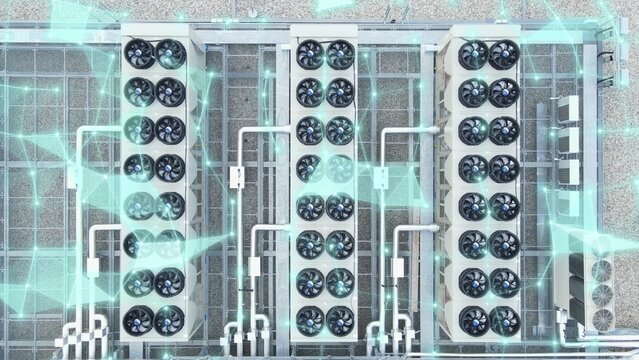 Aerial of data center building with HVAC systems and 3D data graphics overlay showing digital infrastructure
