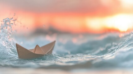 Obraz premium Bright sunset reflects on ocean waves as paper boat sails through water