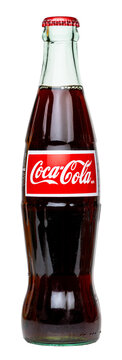 Glass Bottle of Coca Cola Original taste made with real cane sugar, bottled in Mexico, isolated on a transparent background, PNG