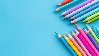 Colorful pencils on blue background, classroom supplies, education concept, back to school