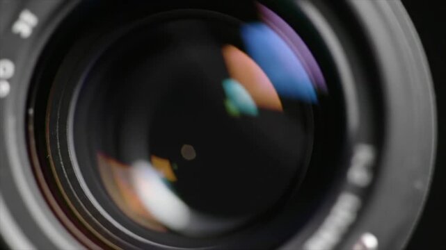 Abstract futuristic camera lens with iridescent flares. 3d animation.