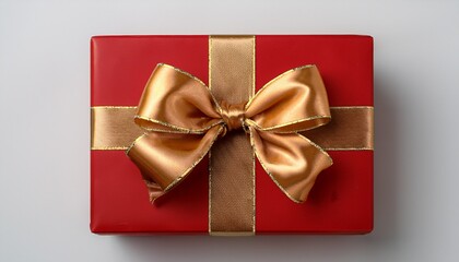 a red gift box with a golden ribbon bow isolated on transparent background the bow is tied with a double loop and the ends of the ribbon are tucked under the bow