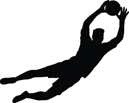 Football goalkeeper diving to catch the ball silhouette