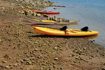 Kayaks Resting on the Shore of Porma Reservoir