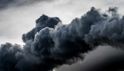 dramatic black smoke cloud with abstract dark texture against monochrome sky
