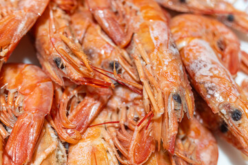 Delicious seafood background with a heap of boiled shrimps