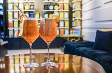 Refreshing tea cocktails with citrus garnish in a specialty tea shop