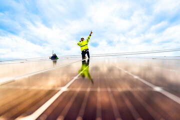 close up on grid of technology renewable solar energy. construction solar panels system on roof....